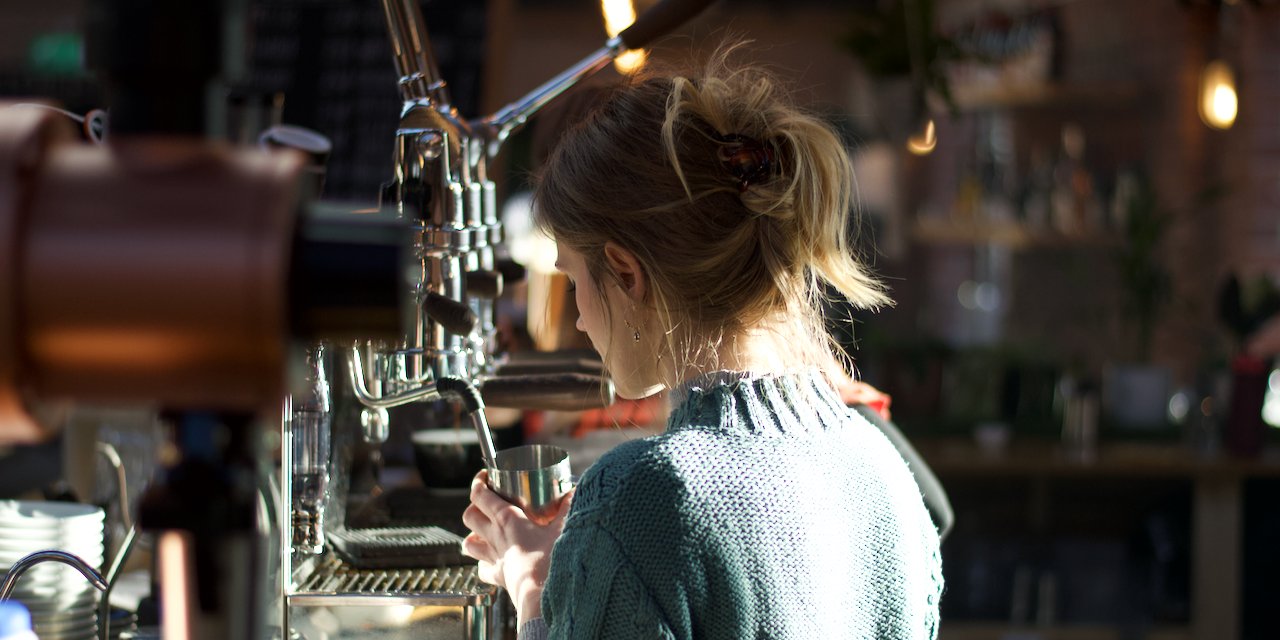 Georgina making coffee on a Londinium espresso machine